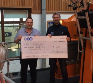 Richard presenting the cheque to steve