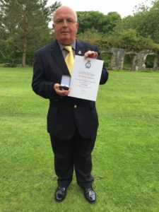 Mike Baldwin with his Gold Badge