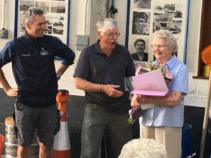 Nancy Thompson receiving flowers and a thank you card