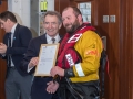 Crew volunteer, Robert 'Tommo' Thompson receives his 20 year service certificate