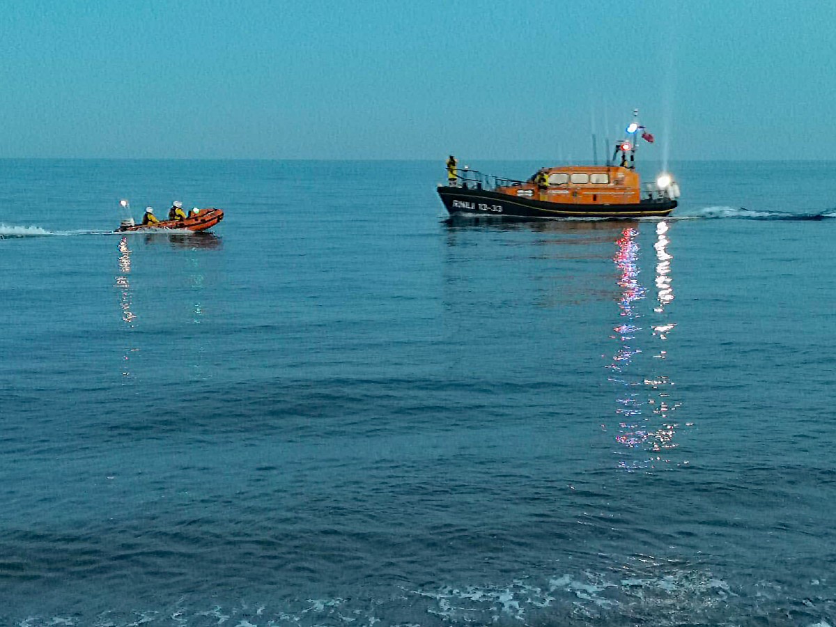 Exmouth RNLI Lifeboats launch to assist rowers in difficulty