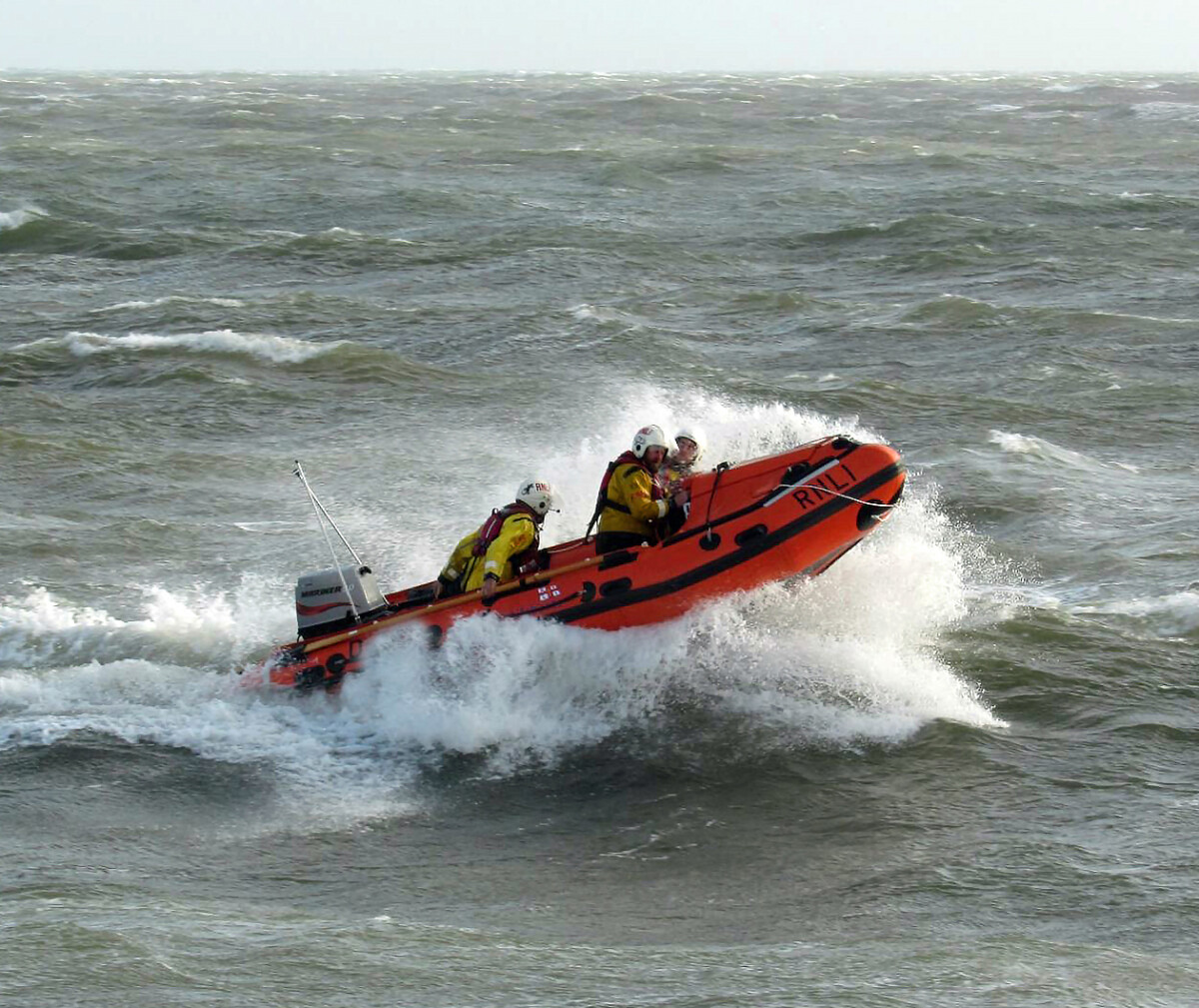 Exmouth RNLI inshore lifeboat rescues drifting kitesurfer